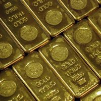 El oro alcanza la cota histórica de 1.000 dólares por onza ante el desplome del dólar