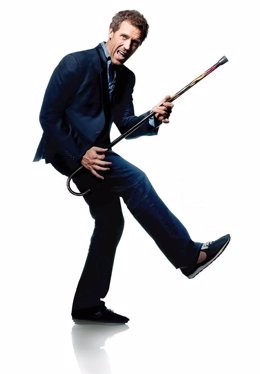 Hugh Lauriene en papel de House finge tocar la guitarra con el bastón