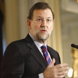 Primer plano de Mariano Rajoy en un desayuno