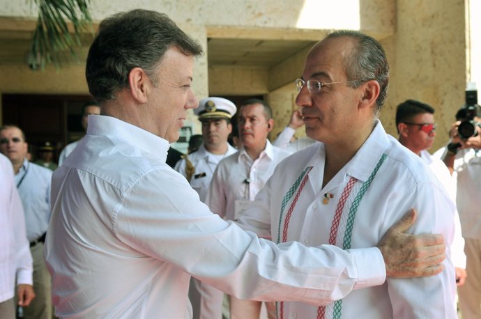 Juan Manuel Santos y Felipe Calderón