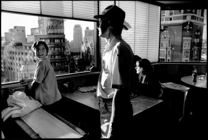 Madrid, Spain. A family looks out over the Gran Via, one of the main streets and