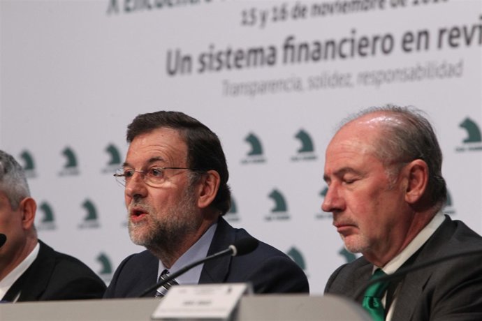 Líder del PP, Mariano Rajoy, junto al presidente de Caja Madrid, Rodrigo Rato