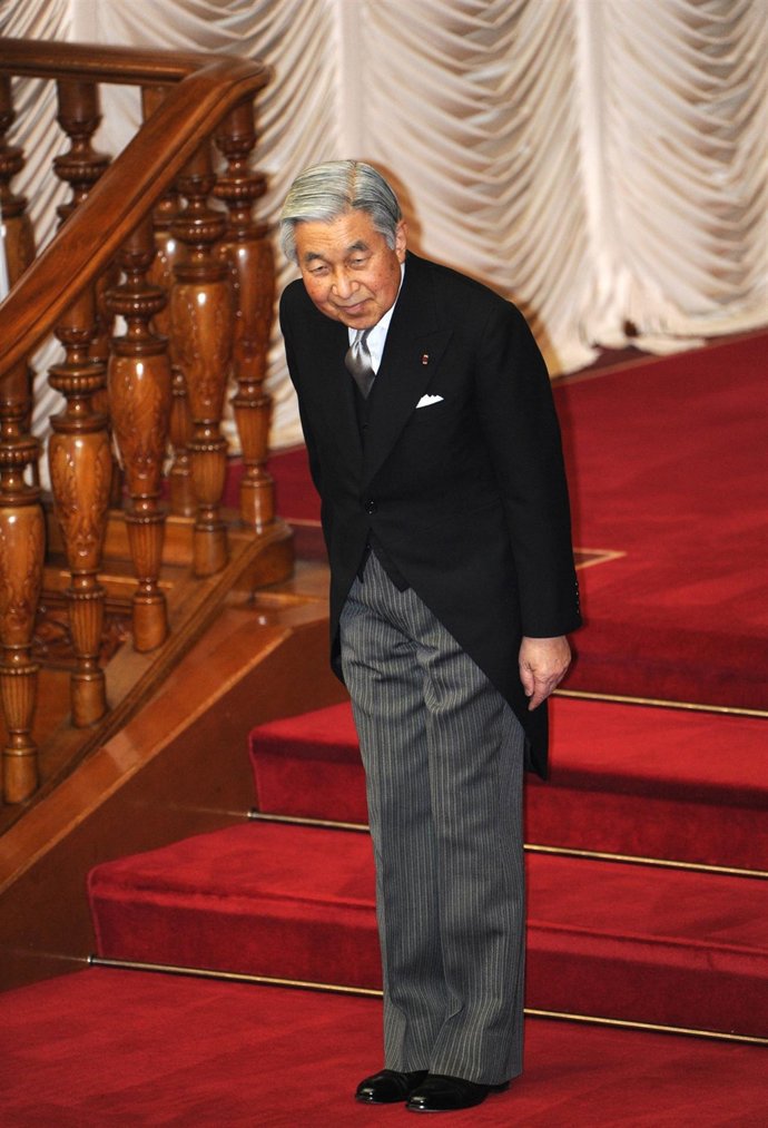 Japanese Emperor Akihito bows after attending the opening ceremony of the Diet s