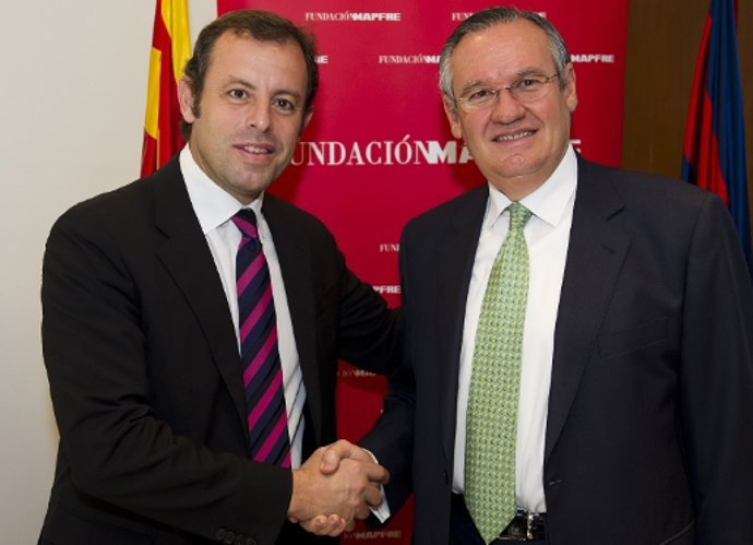 Rosell y Martínez en la firma del convenio