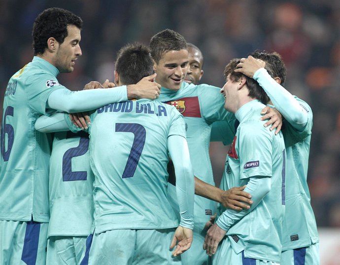 Barcelona's Messi Celebrates With Team Mates After Scoring Against Shakhtar Done