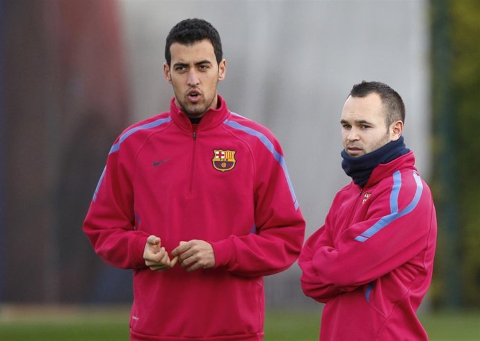 Sergio Busquets y Andrés Iniesta
