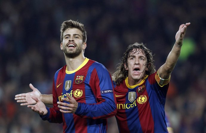 Puyol y Piqué en un partido del Barcelona
