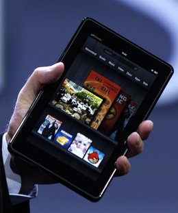 Amazon CEO Bezos Holds Up The New Kindle Fire Tablet At News Conference In New Y