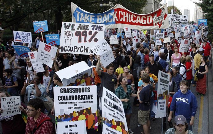 Members Of A Coalition Called "Stand Up Chicago" March During A Protest Down Mic
