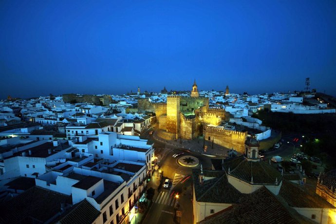 La Puerta De Sevilla, En Carmona, Iluminada Por La Noche.