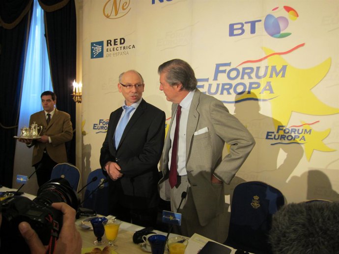 El Comisario De Presupuestos Y El Secretario De Estado Para La UE