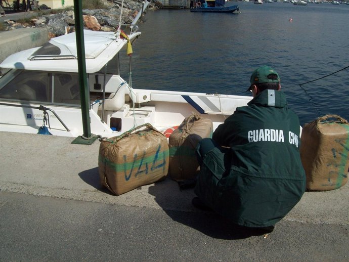 Lancha Interceptada Y Uno De Los Fardos De Hachís Decomisados En Adra