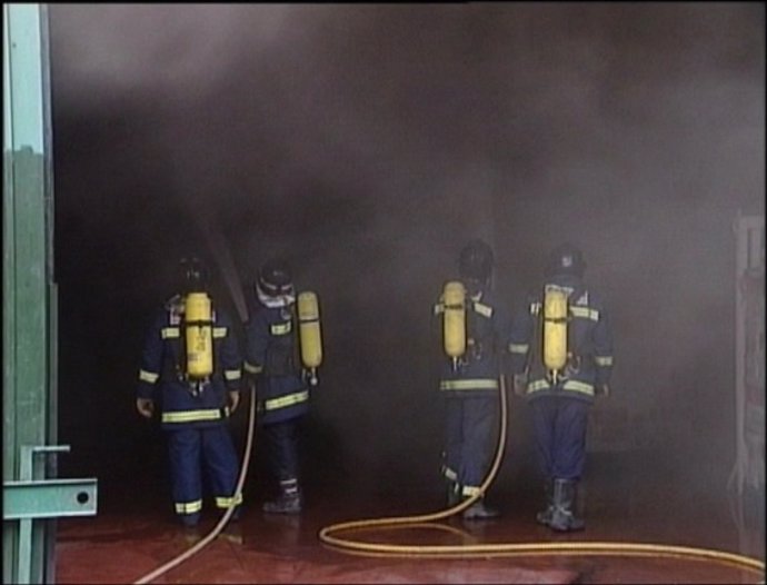 Bomberos En Una Actuación.