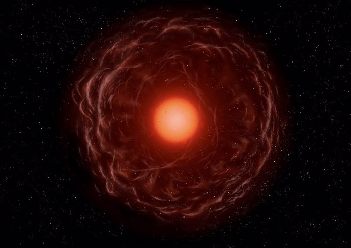 Estrella gigante roja devorando un planeta