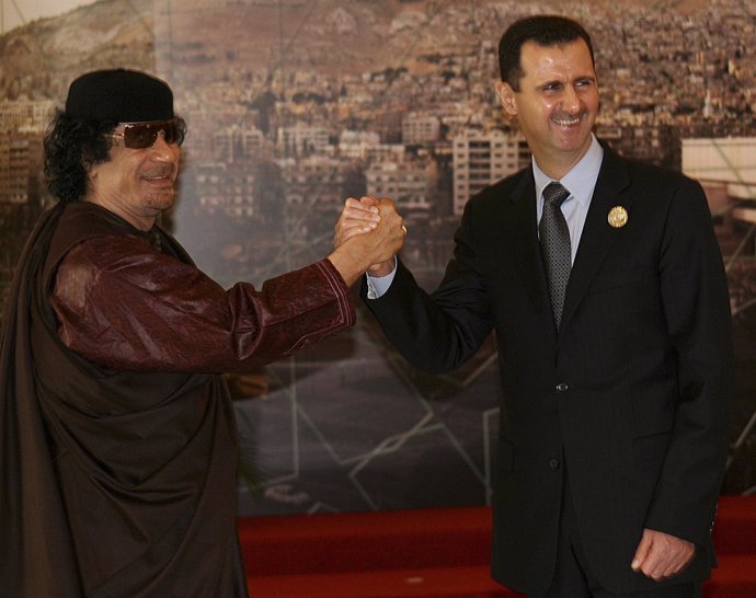 Syria's Bashar al-Assad junto al fallecido Muammar Gaddafi 