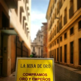 Cartel anunciador de compra-venta de oro 