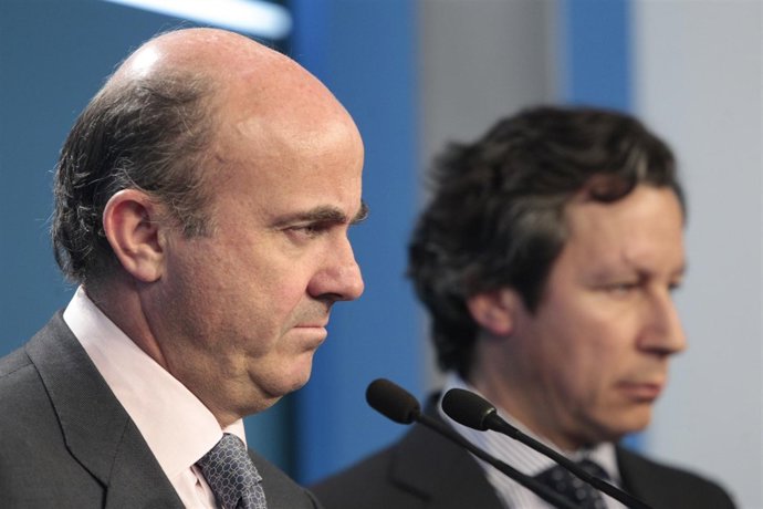 De Guindos y Floriano en la sede del PP