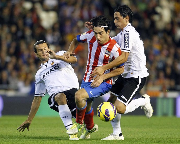 Arda Turan, Nelson Valdez y Ricardo Costa. Valencia-Atlético Madrid