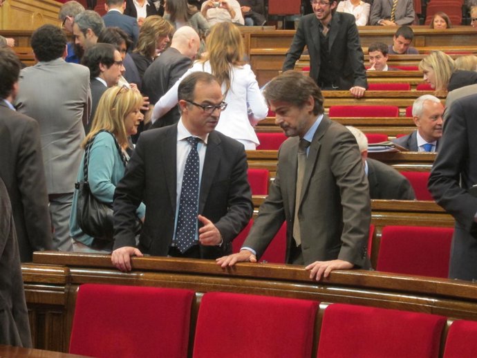 Jordi Turull y Oriol Pujol, en el Parlament
