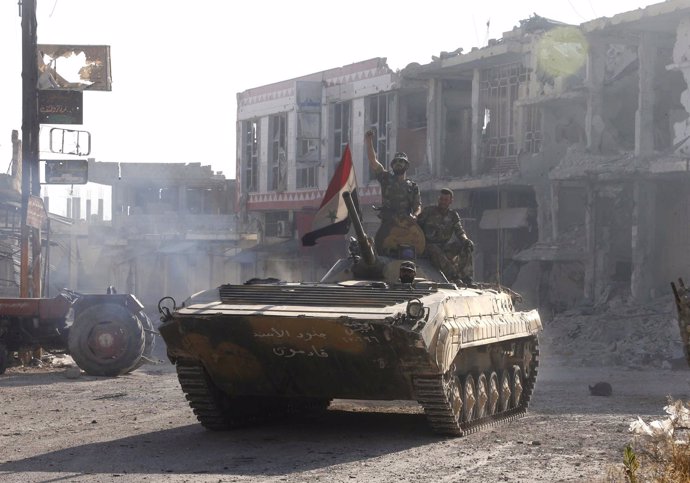 Fuerzas leales al presidente Al Assad recorren victoriosos la ciudad de Qusair