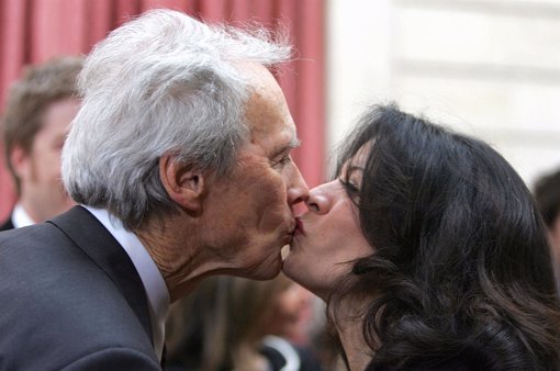 Veteran U.S. Actor and director Clint Eastwood kisses his wife Dina at the Elyse