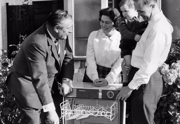 George Ruffel of Edgware, Middlesex and his family admire a Kenwood Dishwasher p