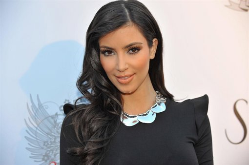 BEVERLY HILLS, CA - JULY 11: Television personality Kim Kardashian arrives at th