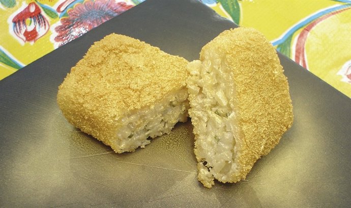 Tapa con lingote de oro