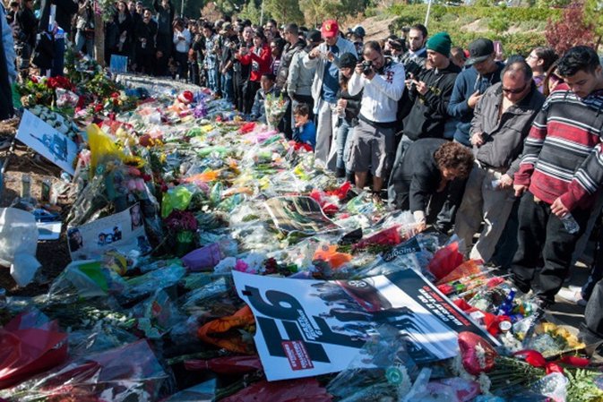 VALENCIA, CA - DECEMBER 08:  Fans brings letters, poem, photos, flowers, candels