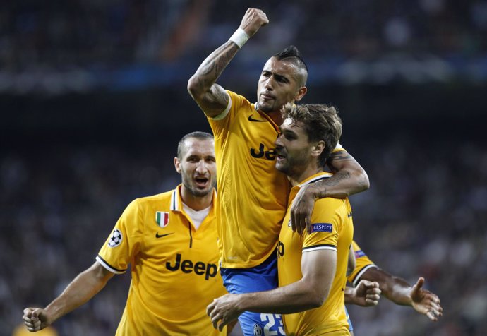 Llorente, Vidal y Chiellini celebran el gol que marcaron en el Bernabéu