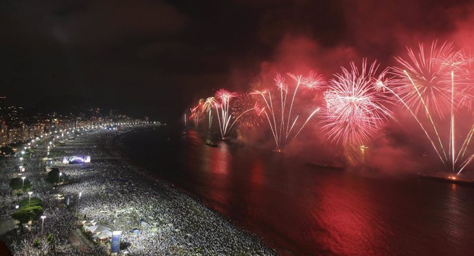 Fireworks explode above Copacabana beach in Rio de Janeiro