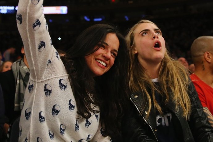 NEW YORK, NY - JANUARY 07:  Actress Michelle Rodriguez sits with with model  Car