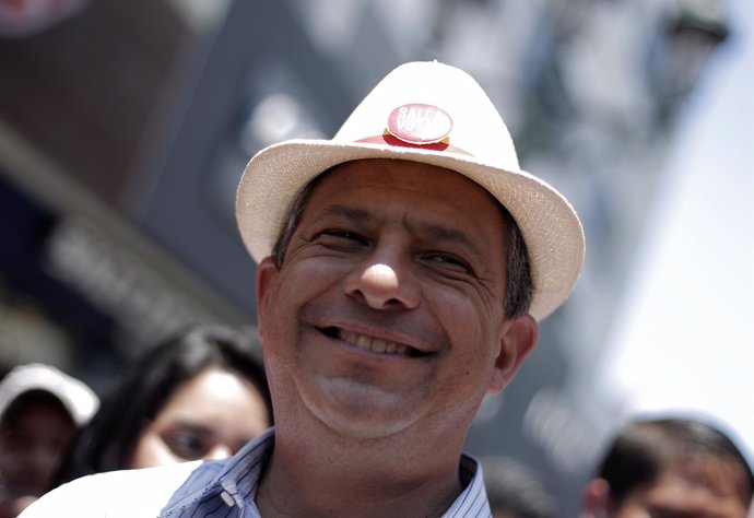Luis Guillermo Solis, presidential candidate of the Citizens' Action Party, smil