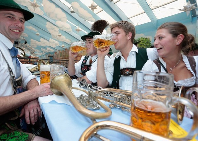 Visitors wearing traditional Bavarian clothes d