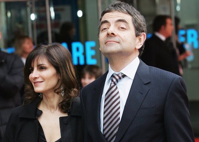 Actor Rowan Atkinson arrives with his wife Sunetra 