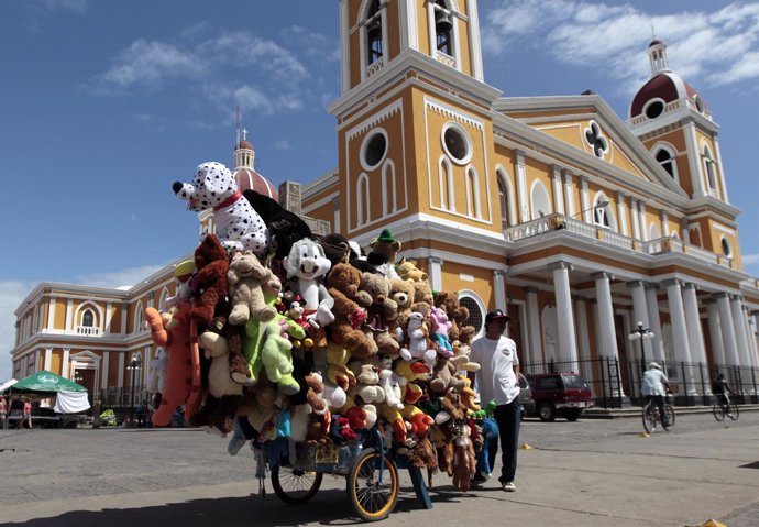 A street vendor sells stuffed animals at the Independence square in the colonial