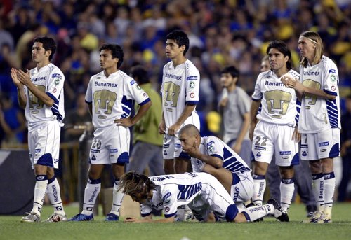 Players of Mexico's Pumas of Unam stand during the penalty shootout at their Cop
