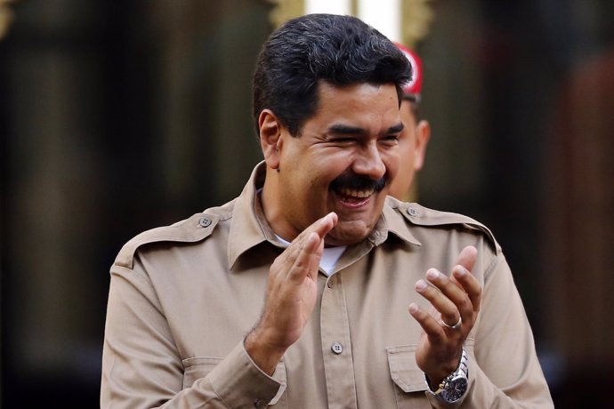 Venezuela's President Nicolas Maduro arrives at a rally to mark his first annive