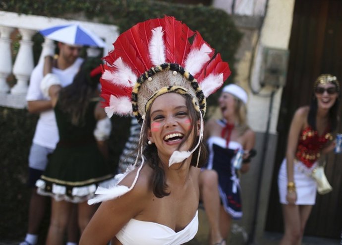 A reveller takes part in the annual block party known 