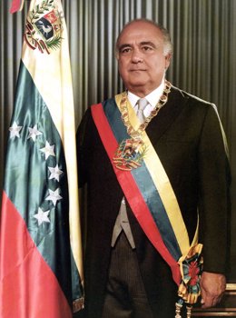 FORMER PRESIDENT LUSINCHI STANDS WITH PRESIDENTIAL SASH IN 1984 FILE PHOTO.