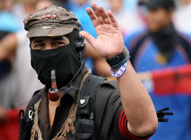 Zapatista leader Marcos waves during demonstration in Mexico City