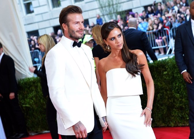 David Beckham (L) and Victoria Beckham attend the 