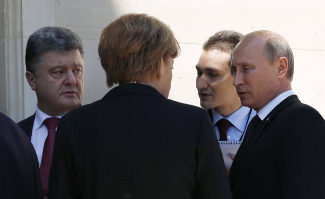 Putin, Poroshenko y Angela Merkel.