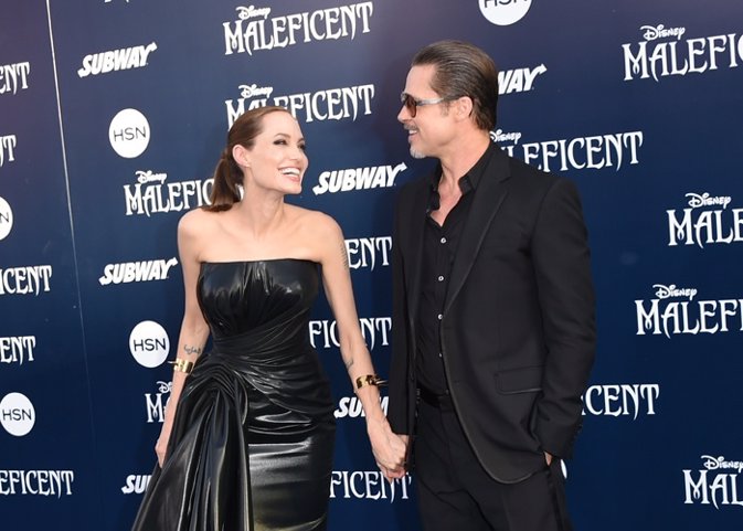 Actors Angelina Jolie and Brad Pitt attend the World 