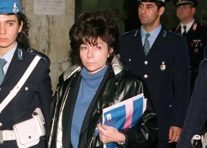 Patrizia Reggiani ex-wife of slain fashion mogul Maurizio Gucci is escorted