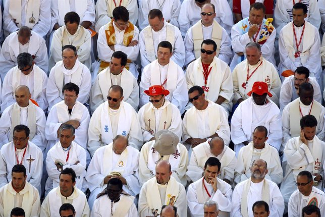 Priests attend World Youth Day's opening mass at Madrid's Cibeles Square