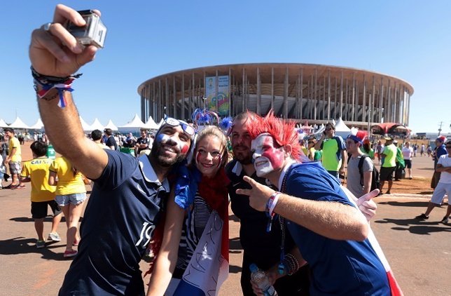France soccer fans take a selfie outside the Brasilia national stadium before Fr