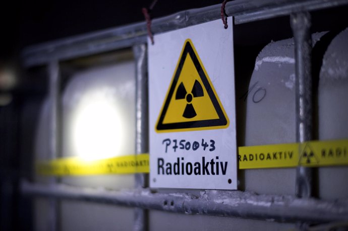 A radiation sign is attached to a barrel containing radioactive water in the Ass