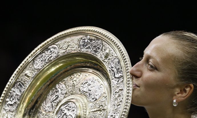 Petra Kvitova of Czech Republic kisses the winner's trophy, the Venus Rosewater 