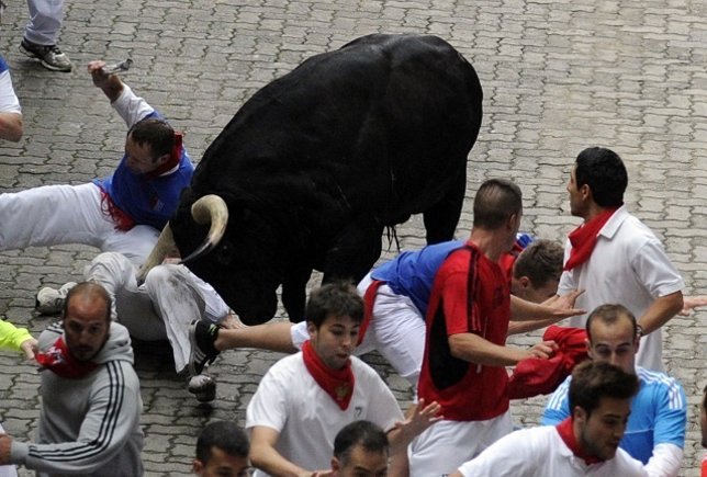 Runner is gored during the third running of the bulls of the San Fermin festival